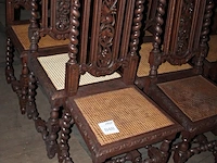 12 antieke eetkamerstoelen met rotan zitting en houtsnijwerk. - afbeelding 2 van  2