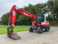 1999 o&k mh plus banden graafmachine - afbeelding 1 van  39