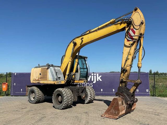 2005 new holland mh plus banden graafmachine - afbeelding 11 van  18
