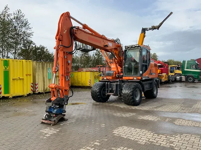 2011 doosan dx140w banden graafmachine - afbeelding 1 van  60