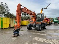 2011 doosan dx140w banden graafmachine - afbeelding 1 van  60