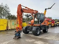 2011 doosan dx140w banden graafmachine - afbeelding 12 van  60