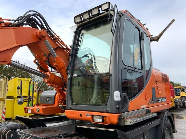 2011 doosan dx140w banden graafmachine - afbeelding 24 van  60