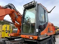 2011 doosan dx140w banden graafmachine - afbeelding 24 van  60