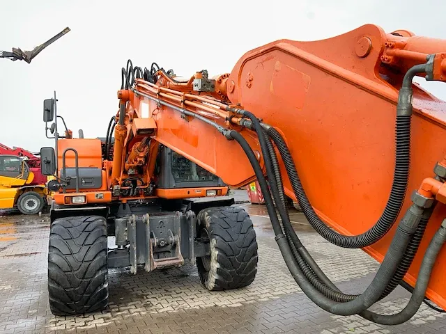 2011 doosan dx140w banden graafmachine - afbeelding 35 van  60