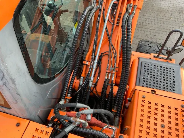2011 doosan dx140w banden graafmachine - afbeelding 49 van  60