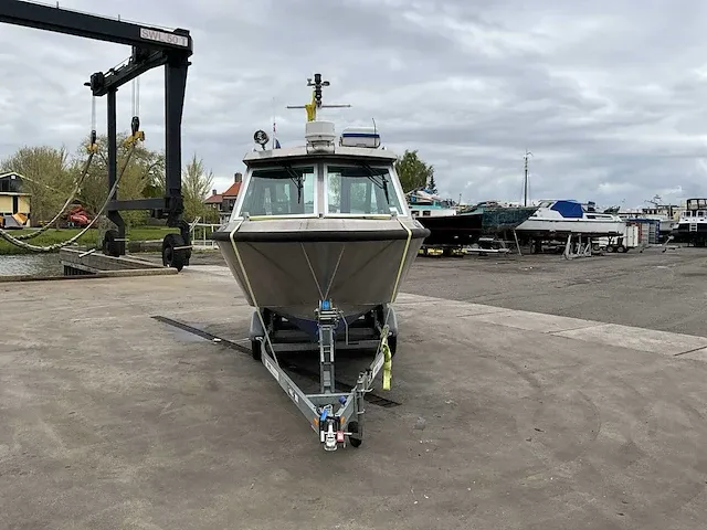 2016 vanvossen alu tender 650 cabin consoleboot inclusief trailer - afbeelding 9 van  32