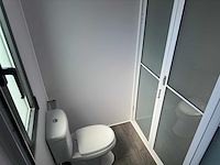 2025 rhino-cross-containers 1 deur en 3 ramen zwart 40ft hq/12 m - containerwoning / container office unit - afbeelding 20 van  35