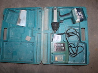 Accuslagmoersleutel makita met accu en acculader in koffer. - afbeelding 1 van  2