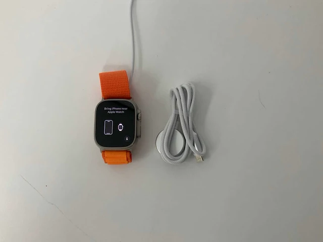 Apple watch ultra 49mm gps+cellular natural titanium with orange wristband - afbeelding 1 van  5