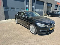 Bmw - automaat - 2013 - 3-serie gran turismo - 320i executive - personenauto - afbeelding 15 van  17