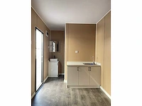 Containerwoning / container unit 40 ft hq / 12 m tiny house enkele woning met apparte slaapkamer - afbeelding 18 van  25