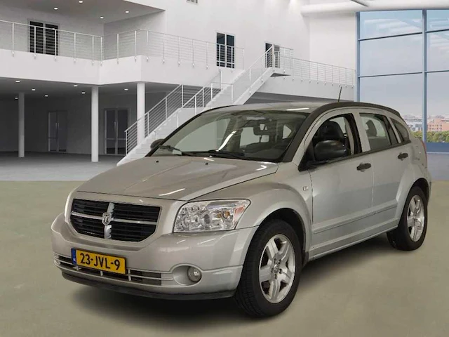 Dodge caliber 1.8 s 2009 | 23-jvl-9 - afbeelding 1 van  17