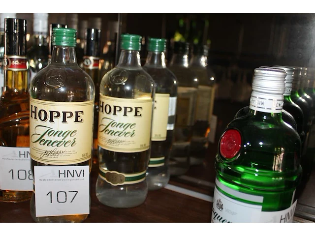 Drie flessen jonge jenever. - afbeelding 1 van  2