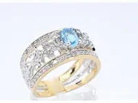 Gouden exclusieve ring vol met diamanten en een edelsteen - afbeelding 4 van  9