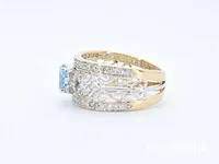 Gouden exclusieve ring vol met diamanten en een edelsteen - afbeelding 5 van  9