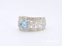 Gouden exclusieve ring vol met diamanten en een edelsteen - afbeelding 8 van  9