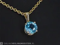 Gouden hanger met topaas