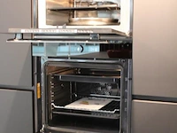 Häcker eilandkeuken met apparatenwand met apparatenwand en spoelwand - afbeelding 55 van  64