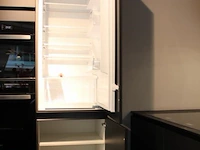 Häcker eilandkeuken met apparatenwand met apparatenwand en spoelwand - afbeelding 57 van  64