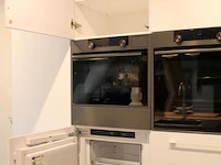 Häcker eilandkeuken met apparatenwand - afbeelding 14 van  41