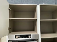 Häcker exclusieve eiland keuken met wand opstelling en kookplaat met afzuiging - afbeelding 17 van  50