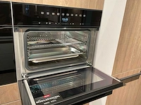 Mk zera fm hoekopgestelde showroomkeuken met hoge wandkasten - afbeelding 35 van  46