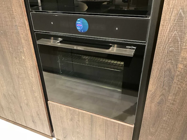Mk zera ver sy eiland showroomkeuken met hoge kastenwand - afbeelding 39 van  48