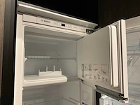 Mk zera ver sy eiland showroomkeuken met hoge kastenwand - afbeelding 43 van  48
