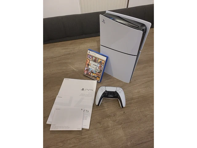 Playstation 5 disc edition console (in nieuwstaat) + gta 5 game + draadloze controller + kabels & handleiding - afbeelding 1 van  12