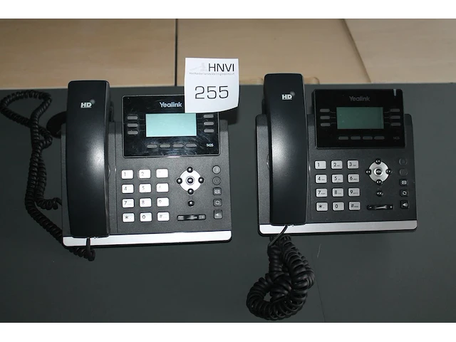 Twee telefoontoestellen yealink ultra-elegant gigabit ip phone sip-t42s. - afbeelding 1 van  1