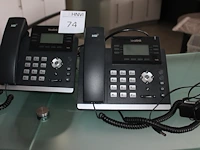 Twee telefoontoestellen yealink waaronder ultra-elegant gigabit ip phone sip-t48g. - afbeelding 1 van  1