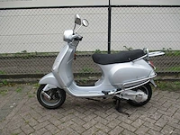 Vespa - motorscooter - lx 125 - motorfiets - afbeelding 1 van  11
