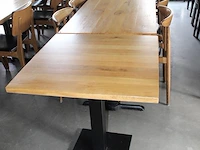 Vier horecatafels met 12 houten stoelen. afmeting tafels 3 maal 120 x 120 x 75 cm en 1 maal 70 x 70 x 75 cm onderdeel van combinatiekavel combinatie van kavels g001, g013, g014 en g015 zijnde 15 horecatafels in diverse afmetingen met 50 houten stoelen. - afbeelding 7 van  8