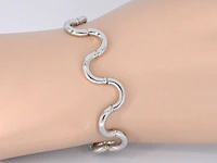 Witgouden armband van het italiaance merk unoaerre italian brev: gold hinged swirl link armband - afbeelding 2 van  8
