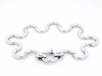 Witgouden armband van het italiaance merk unoaerre italian brev: gold hinged swirl link armband - afbeelding 3 van  8