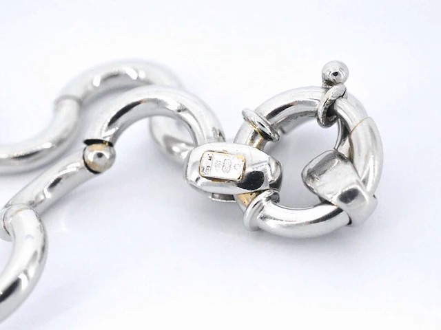 Witgouden armband van het italiaance merk unoaerre italian brev: gold hinged swirl link armband - afbeelding 6 van  8