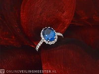 Witgouden ring met een ovale blauwe edelsteen - afbeelding 5 van  9