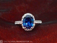 Witgouden ring met een ovale blauwe edelsteen - afbeelding 7 van  9