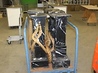 Zes hardstenen pilaren 29 x 29 x 88 cm met gebruikssporen. - afbeelding 1 van  3