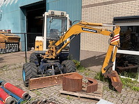 1992 komatsu pw30 banden graafmachine - afbeelding 2 van  8