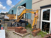 1992 komatsu pw30 banden graafmachine - afbeelding 4 van  8