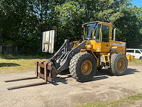 1999 volvo l70c wiellader met puinbak, vorkenbord en hijsjuk