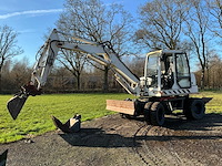 2004 komatsu pw95 banden graafmachine - afbeelding 1 van  21