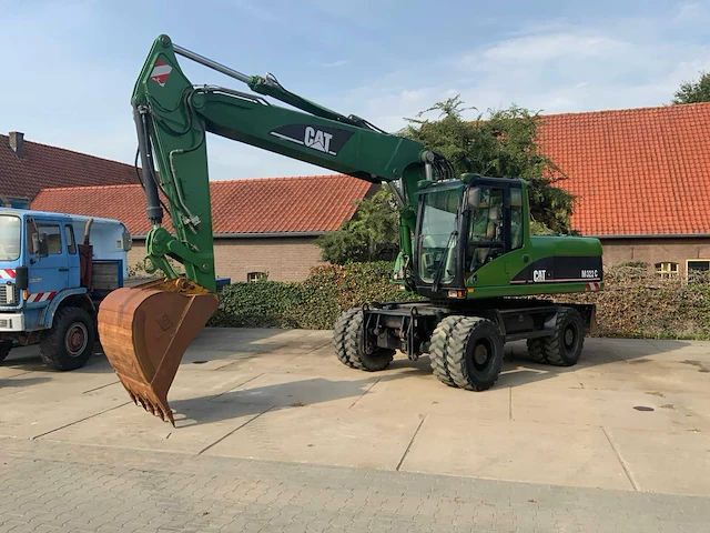 2006 caterpillar m322c banden graafmachine - afbeelding 1 van  49