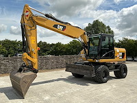 2011 caterpillar m316d banden graafmachine