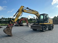 2014 new holland we150b pro banden graafmachine