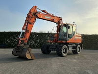 2015 doosan dx140w-3 banden graafmachine - afbeelding 1 van  21