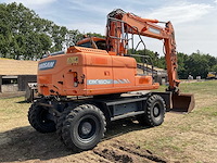 2015 doosan dx160w-3 banden graafmachine