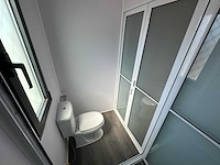 2025 rhino-cross-containers 1 deur en 3 ramen zwart 40ft hq/12 m - containerwoning / container office unit - afbeelding 19 van  35